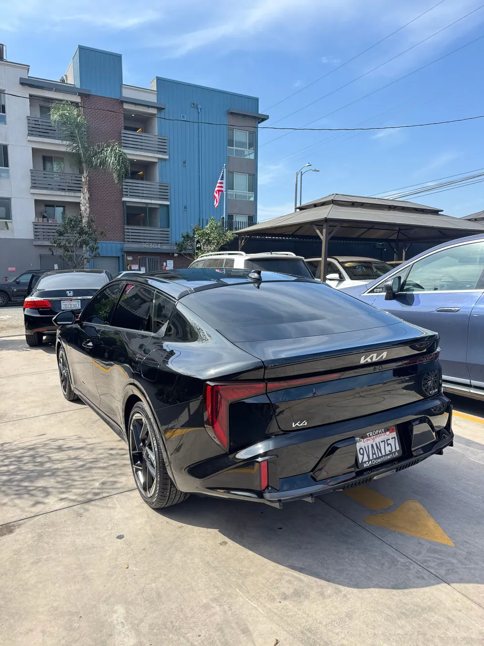 Black Kia EV6 from the rear in the Aramex lot