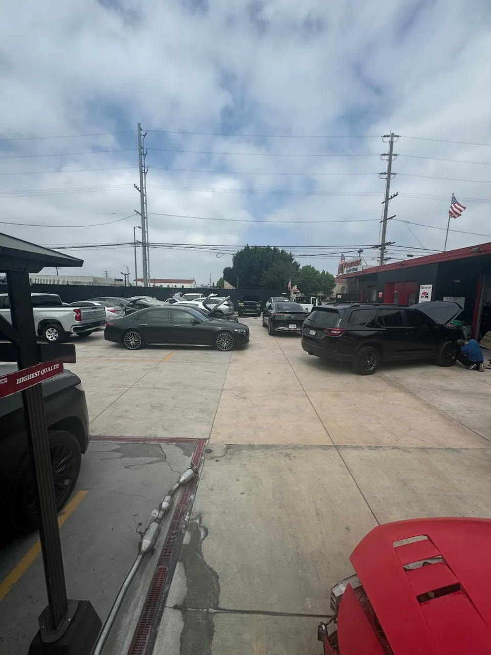 Vehicles parked across the Aramex Body Shop lot